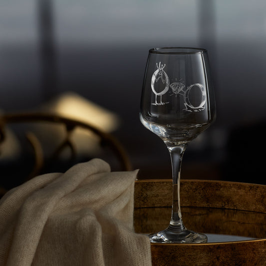 stemmed wine glass engraved with an illustration of an engagement ring proposing to his girlfriend ring