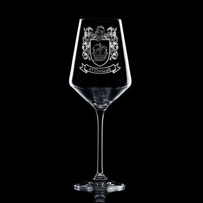 Stemmed wine glass engraved with family crest - deep sandblasted detail.