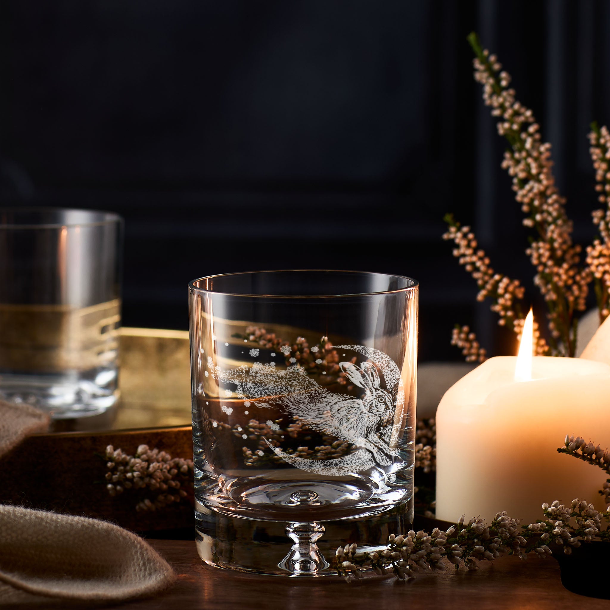Winter snowflakes whisky glass with engraved leaping hare and crescent moon
