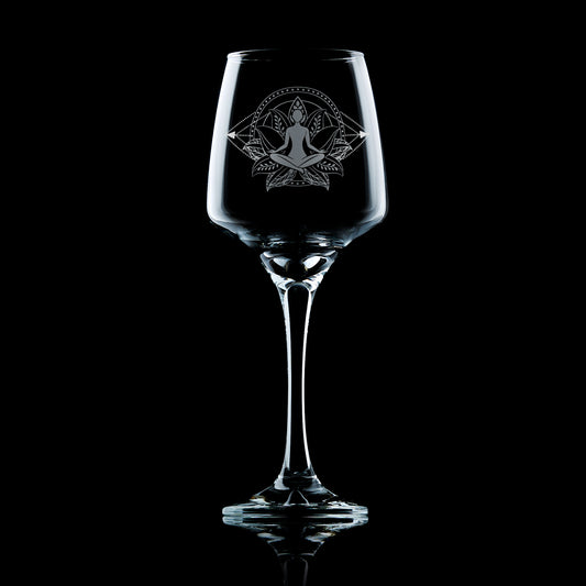 stemmed wine glass engraved with a yoga psoe