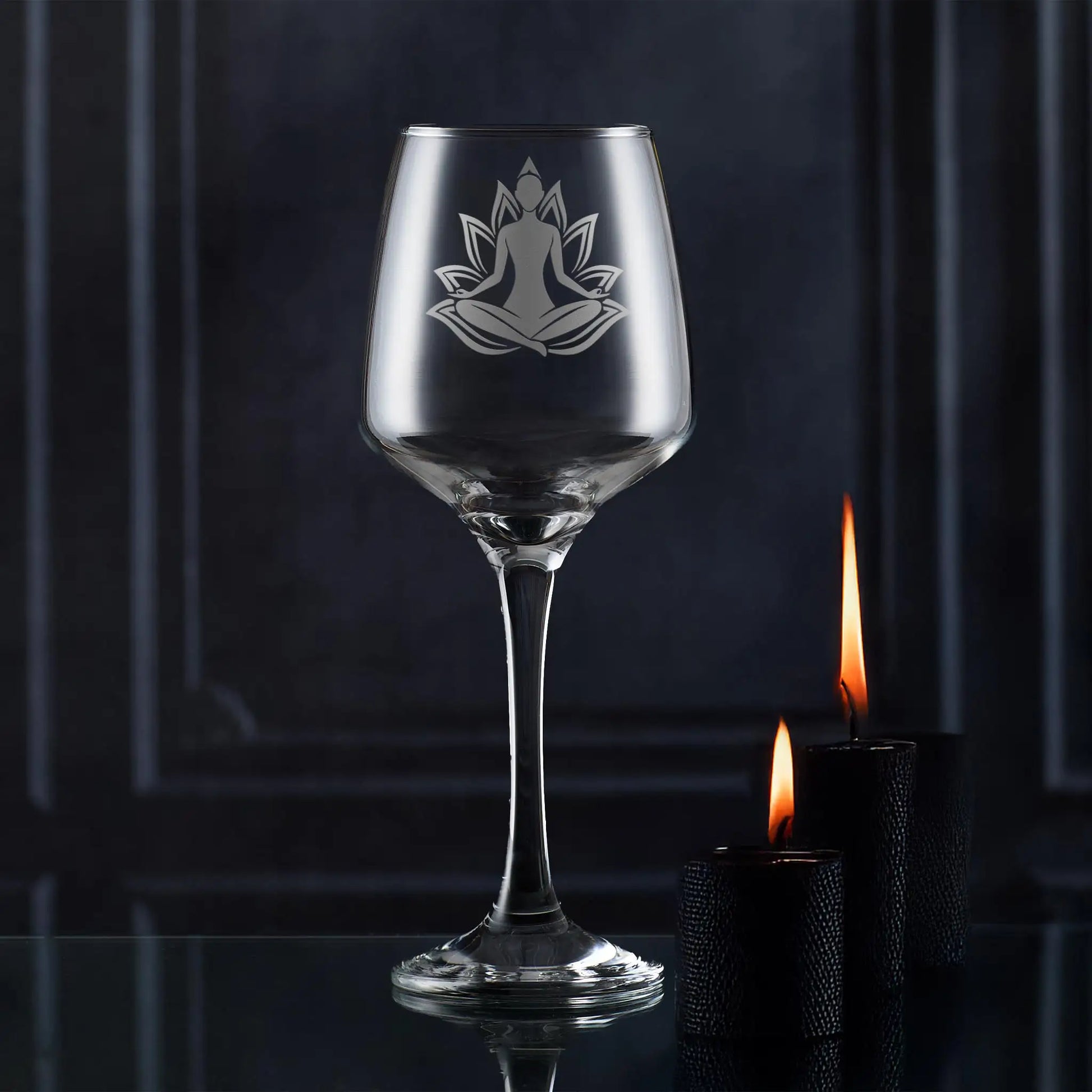 Wine glass engraved with a woman practicing Yoga set against a lotus flower